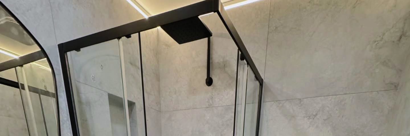 Walk-in shower with a glass enclosure