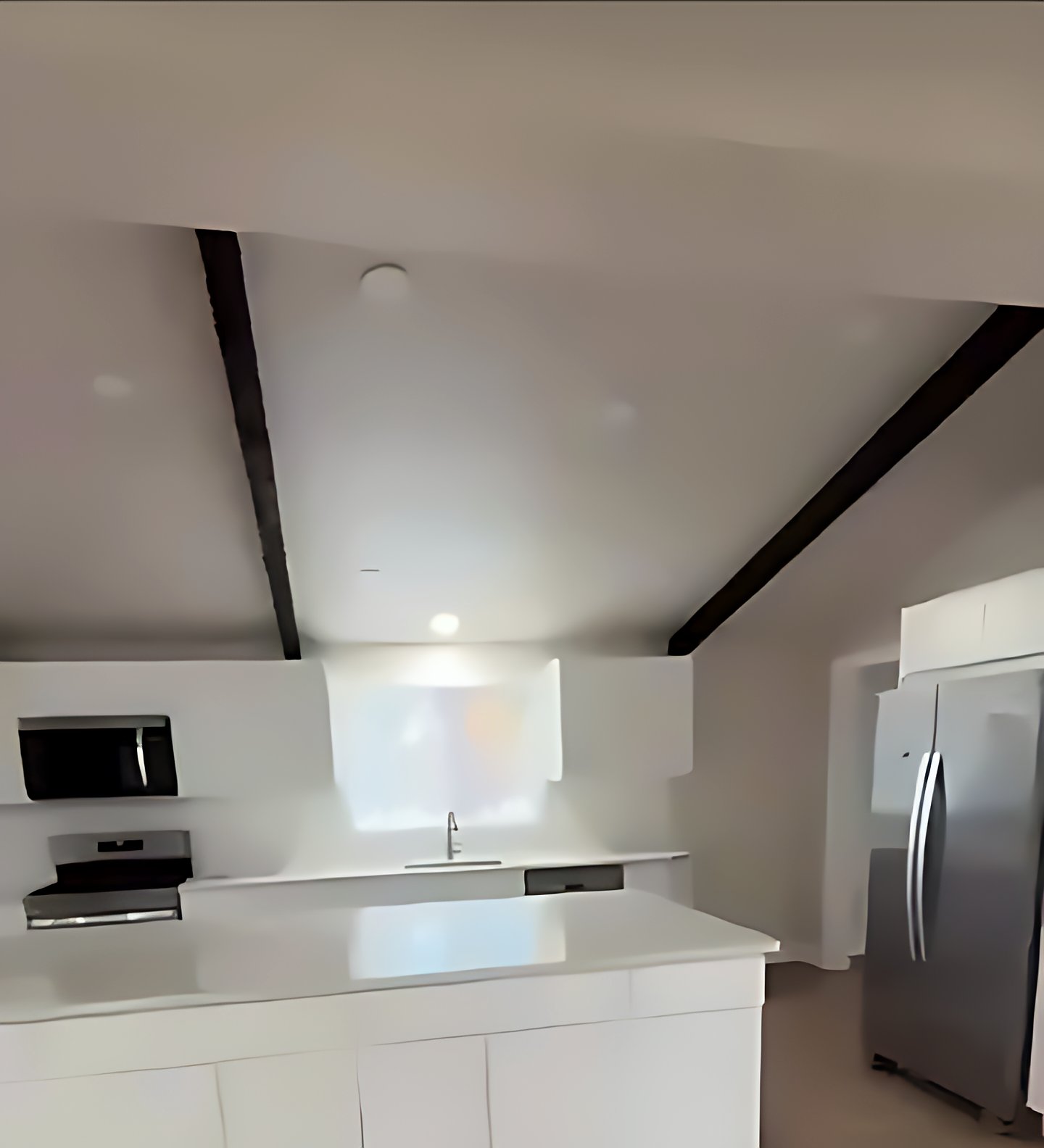 Remodeled open kitchen with a white island