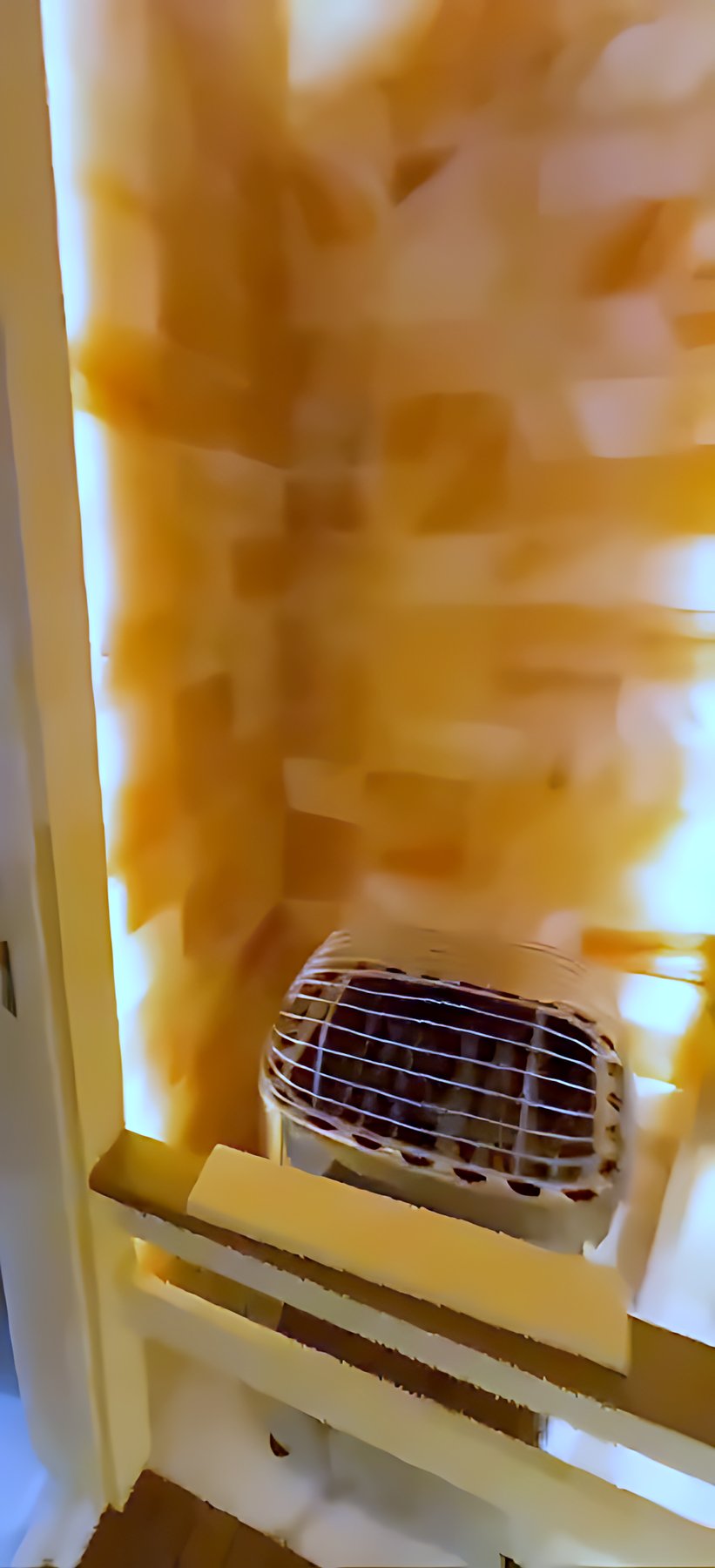Custom sauna with a backlit salt-stone wall